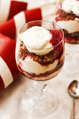 Glass of creamy strawberry jam on the table
