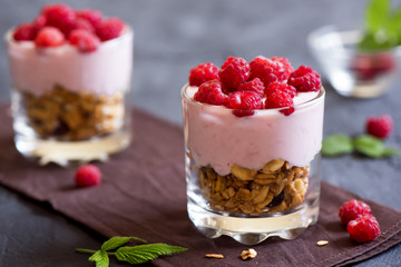Fototapeta na wymiar yogurt, raspberries and granola
