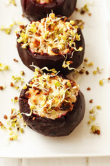 Baked beets with cheese filling on white dish