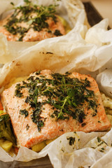 Fried roasted salmon with rosemarry in wrapped paper