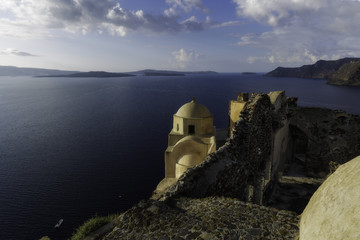 Caldera view  from old ruins church of Oia village, Santorini island, Greece