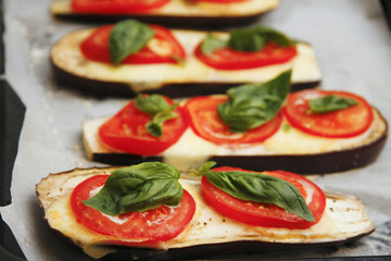 Grilled food and additives with tomatoes basil and eggplant