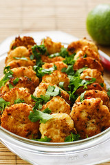 Haddock cutlets with chili, lime and ginger on white platter