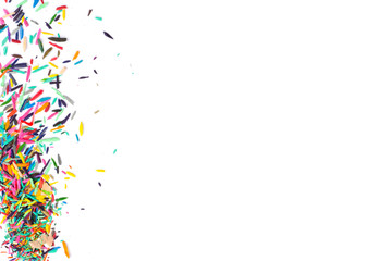 Blank white paper covered in colored pencils sharpening leftovers