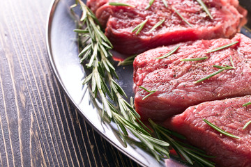 Beef steak with rosemary , salt and pepper.
