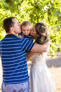 happy young family mother father son have fun in summer park