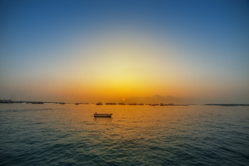 Sunset small boat