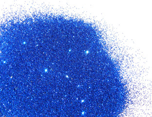 Blue glitter sparkles on white background. 