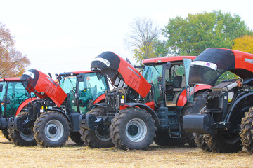 Agricultural machinery. Tractor, standing in a row