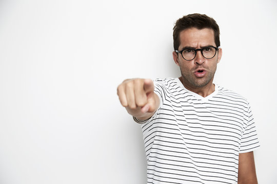 Guy angrily pointing at camera, portrait