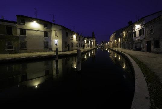 Houses along the canals at twilight, Comacchio, Italy