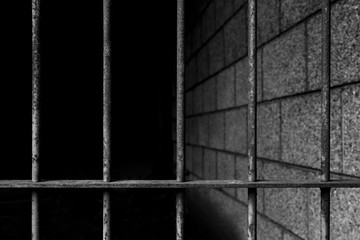 old prison bars cell lock background dark black and light