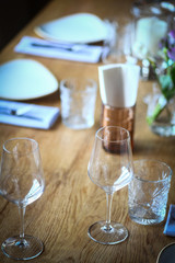 Fork and knife on a table, near a plate