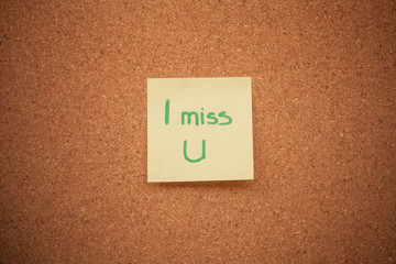 Miss you note on cork board