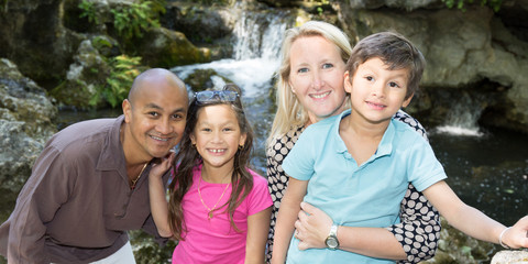 Mixed family multiracial with a blond Caucasian woman and an indian man with their two children...