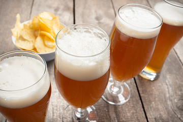 glass beer on wood background