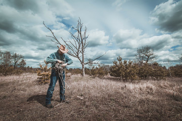 Cowboy folds the rope,