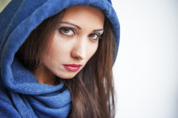 portrait of a brunette with brown eyes gaze in the hood