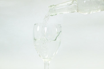 water splash in glass isolated on white