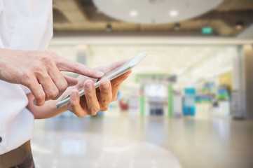 mobile concept.Business man hands holding touch screen smartphone