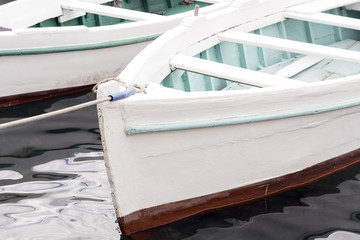 Fototapeta na wymiar Old white wooden small boat