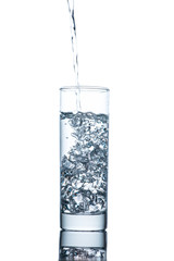 Drinking water is poured into a glass