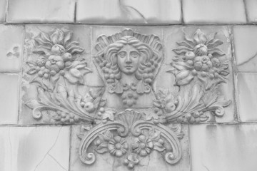 Goddess of fertility bas-relief on a fence