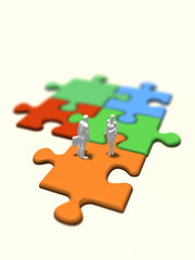 Business figure on colorful jigsaw puzzle