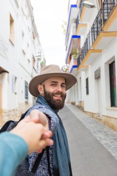 Man holding photographer's hand