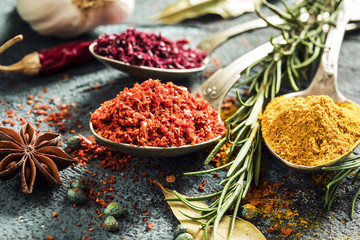 Spices and herbs on wooden background