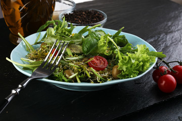 Bowl of salad on wooden table