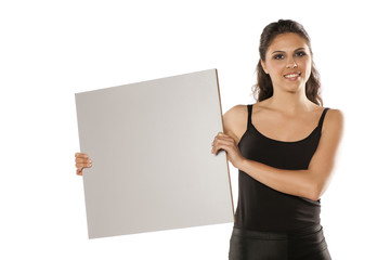 young beautiful brunette holding a blank board for advertisement