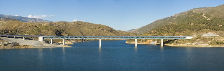 Panoramic of a bridge over a dam.