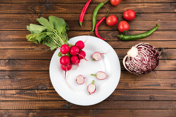 different fresh seasonal vegetables on wooden table top texture