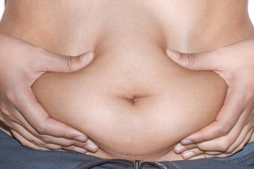 Close up handing front of woman belly fat overweight