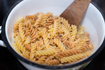 Italian fusilli pasta homemade cooked boiled in a saucepan