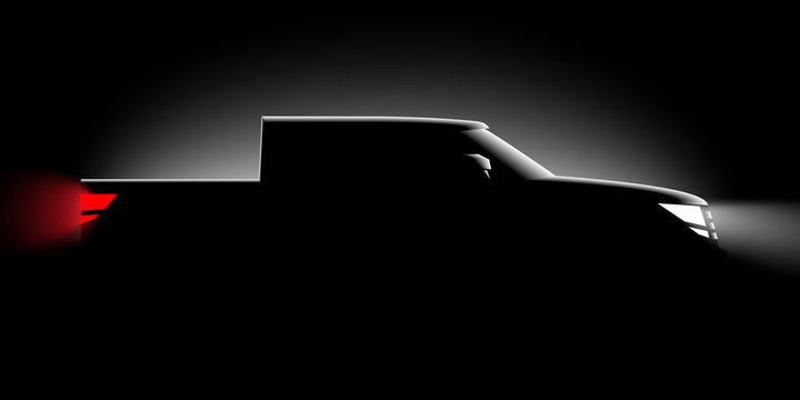 realistic pickup off-road car iin the dark in the spotlight is a side view
