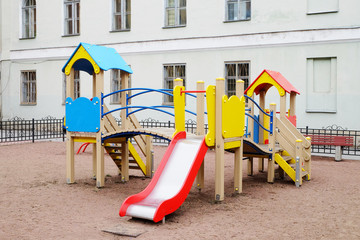 children's playground in the yard of the old house