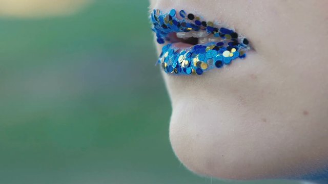Close up creative make up of lips. Slow motion
