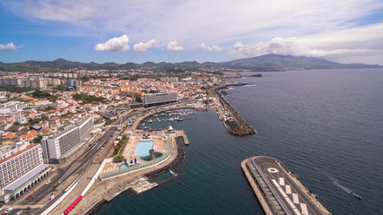 Fototapeta na wymiar City with harbor at Ponta Delgada, capital city of the Azores at Sao Miguel Island