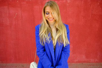 Portrait of the girl in the blue coat on the street, stylish outfit, woman fashion, street shooting
