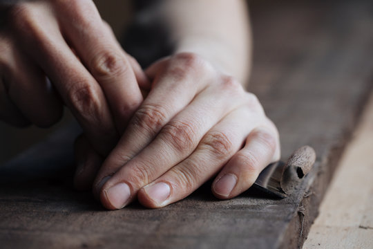 Wood Carving, The Master's Hands Work With A Wooden Surface, A Professional Does Wood Crafts