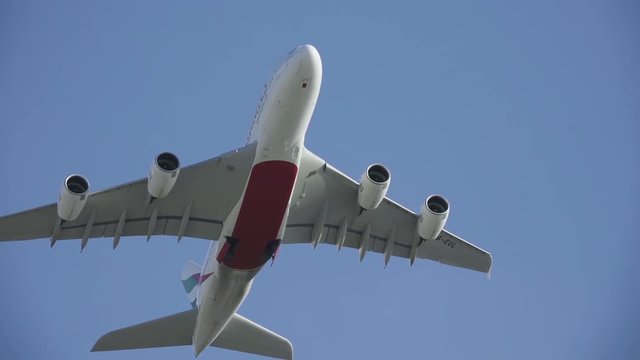 Aircraft flying on HD travel slow-motion video. Plane flight on blue clear sky