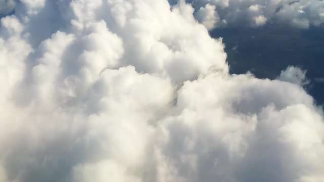 Cloudscape HD nature aerial video background. Flying above сumulus clouds view from air plane