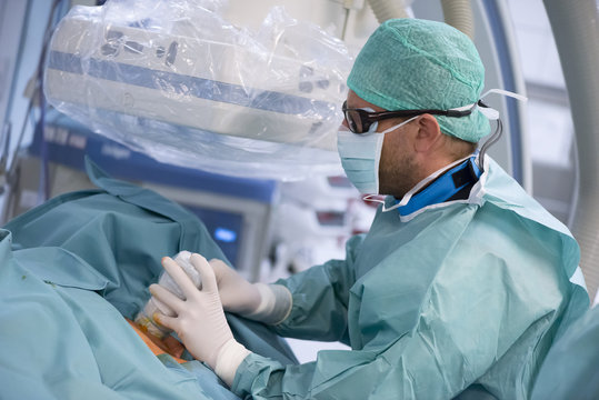 Radiologist controlling puncture site with ultrasound
