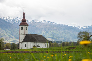 catholic church in field among Alps