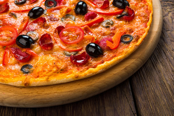 Delicious pizza with salami, mushrooms and olives