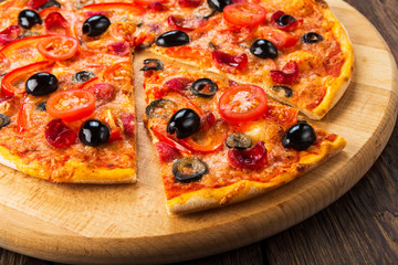 Delicious pizza with salami, mushrooms and olives