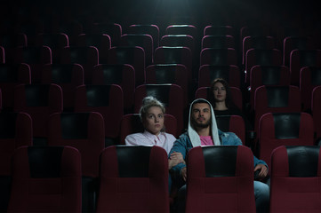 People watching movie in cinema theater