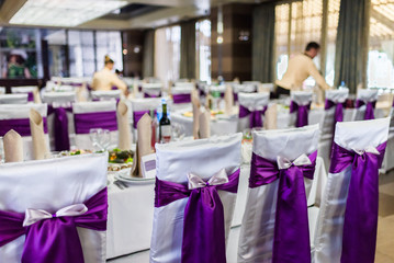 Decorated chairs in the wedding restaurant